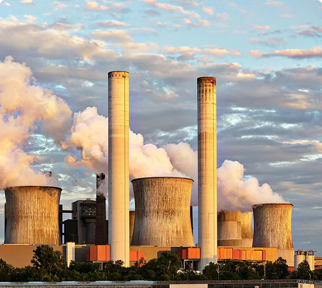 Industrial manufacturing facility with emissions stacks